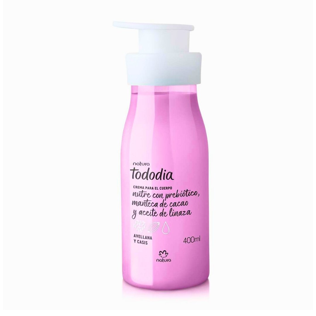 Crema corporal Tododia Avellana y Casis de 400ml en botella rosa pálido con dispensador, con nutrición prebiótica.