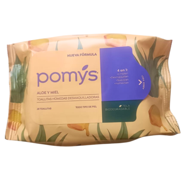 Fotografía sobre fondo blanco de un paquete de toallitas húmedas desmaquilladoras de la marca Pomys, variedad Aloe y Miel. El empaque es de color crema con ilustraciones de hojas verdes de aloe vera y trozos de panal con miel goteando. En el centro destaca el logotipo "pomys" en letras moradas junto al texto "NUEVA FÓRMULA" y "ALOE Y MIEL". Al lado derecho, una sección morada detalla en blanco "4 en 1: Limpian, Desmaquillan, Suavizan, Humectan", acompañada por una pestaña de apertura que dice "ABRIR AQUÍ". En la esquina inferior derecha, una franja verde oscuro indica "TELA BIODEGRADABLE", y en la parte inferior central se lee "28 TOALLITAS" y "TODO TIPO DE PIEL".